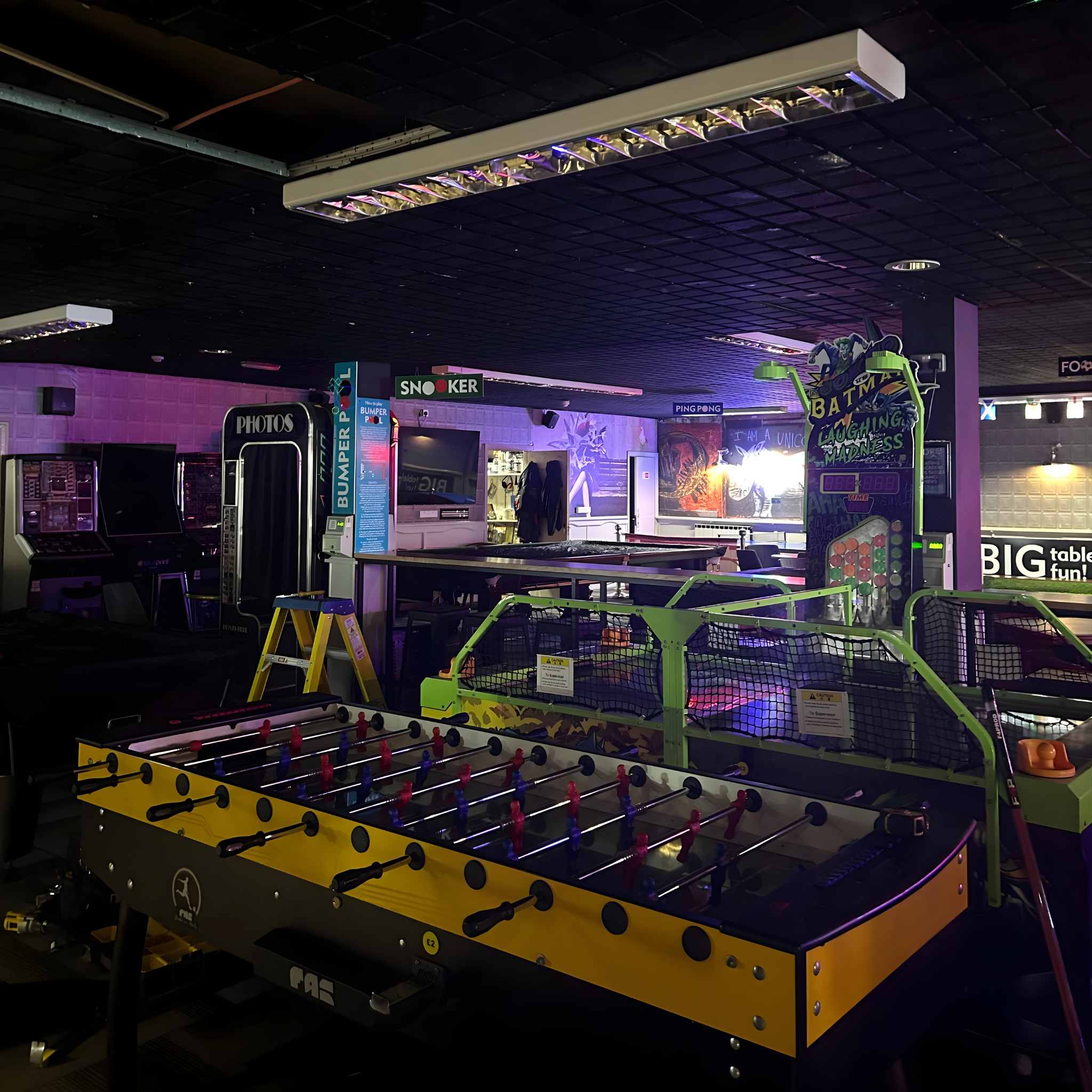 A over-head strip light installed in the arcade in the Royal Pier. The light is directly above the foosball table.
